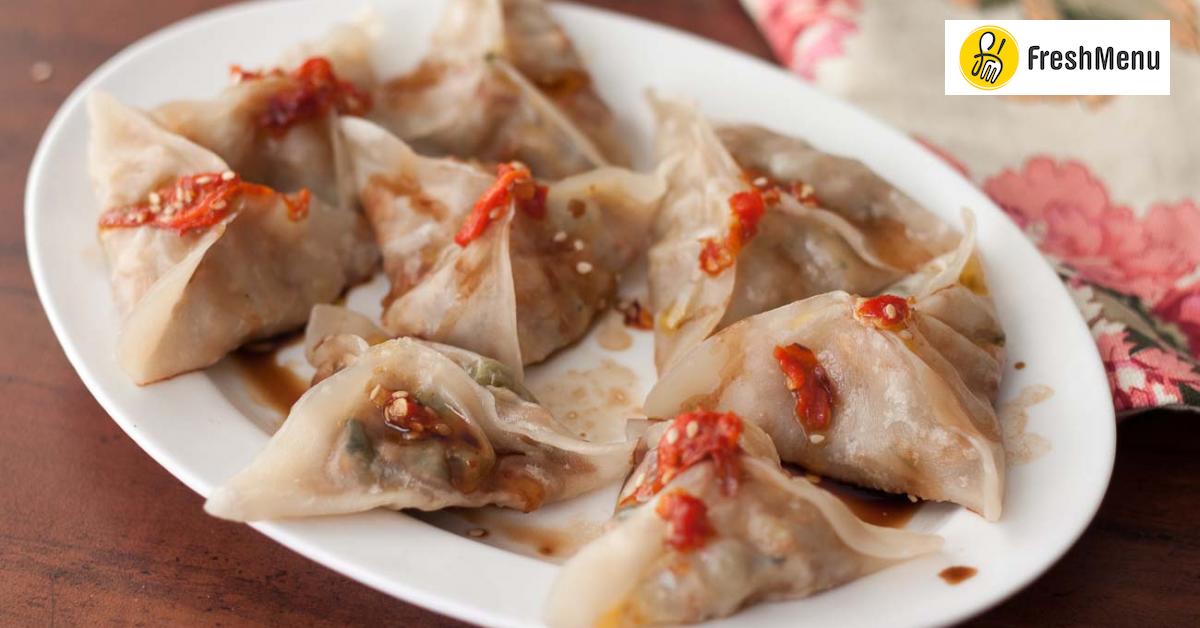 Sichuan Style Zhong Shui Jiao Recipe (Caramelized Onion, Cabbage And Peas Dumplings in Red Oil Recipe) by Archana’s Kitchen