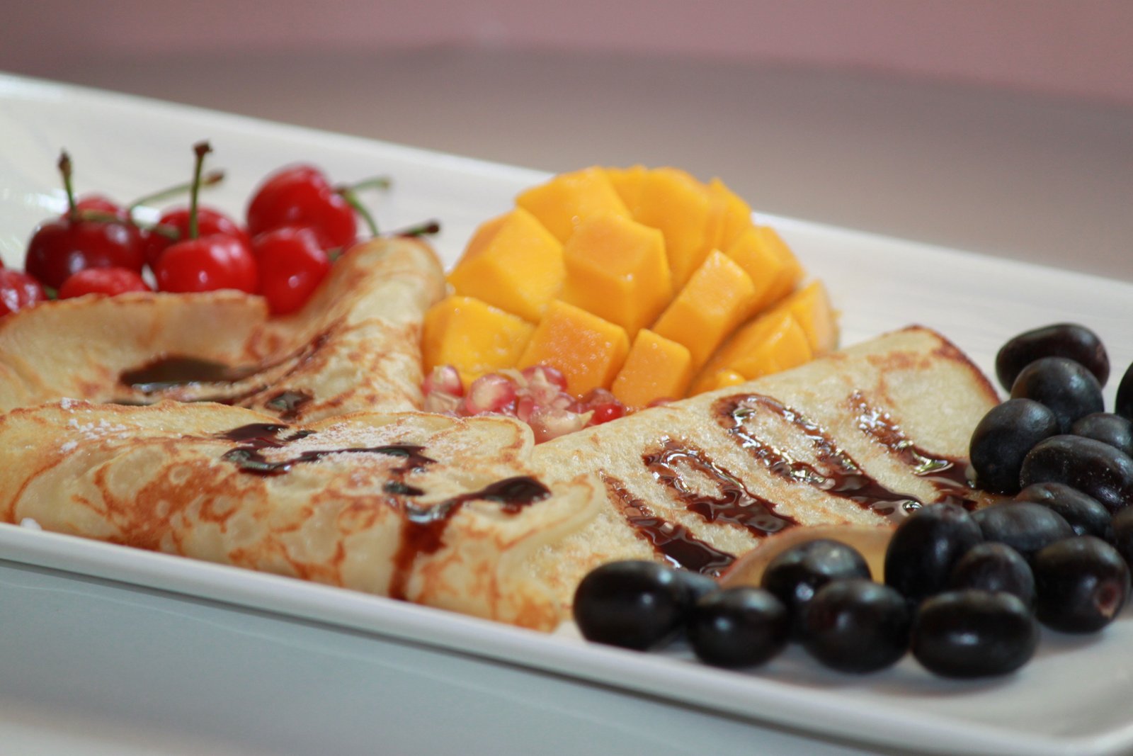Pancakes Drizzled With Chocolate Sauce Served With Fruits & Jaggery Recipe (Breakfast In Bed)