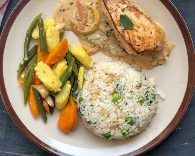 Enjoy A Weekend Dinner With Chicken In Lemon Butter Sauce, Steamed Vegetables & Herbed Rice