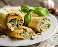 Spinach Ricotta filled Crepes with Pepper Cream Sauce
