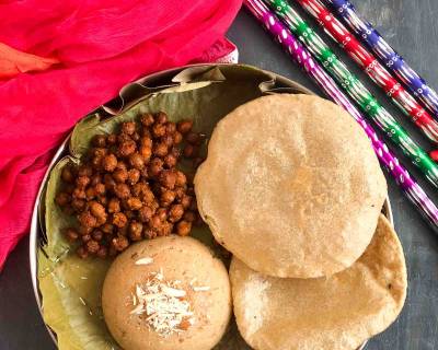 Enjoy A Festive Meal Of Sukha Kala Chana, Puri and Sooji Halwa
