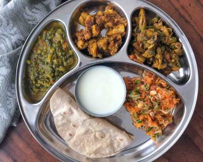 Portion Control Meal Plate: Dal Palak, Arbi Ajwain Sabzi, Tawa Mushroom, Carrot & Tomato Salad And Homemade Curd