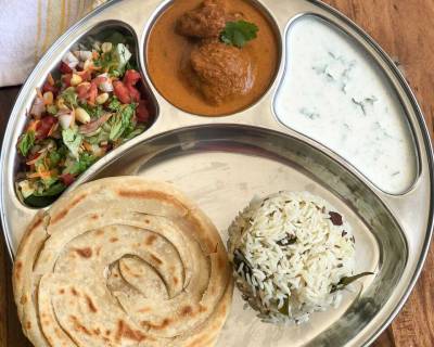 Try Our Lip-Smacking South Indian Meal With Ghee Rice Malabar Paratha Raita Salad & Paniyaram Muttai Masala