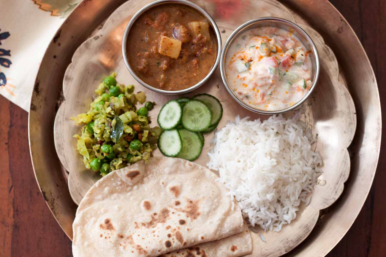 Everyday Meal Plate: Ellu Kuzhambu, Cabbage Thoran, Phulka & Tadka Raita by Archana's Kitchen