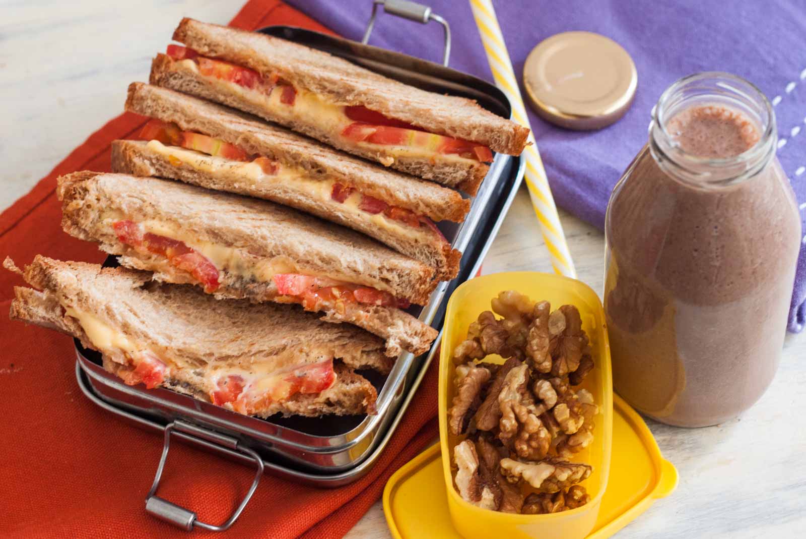 Kids_Lunch_Box_Meal_Tomato_and_Cheese_Grill_Sandwich_walnuts_banana_and_choclate_smoothie 2