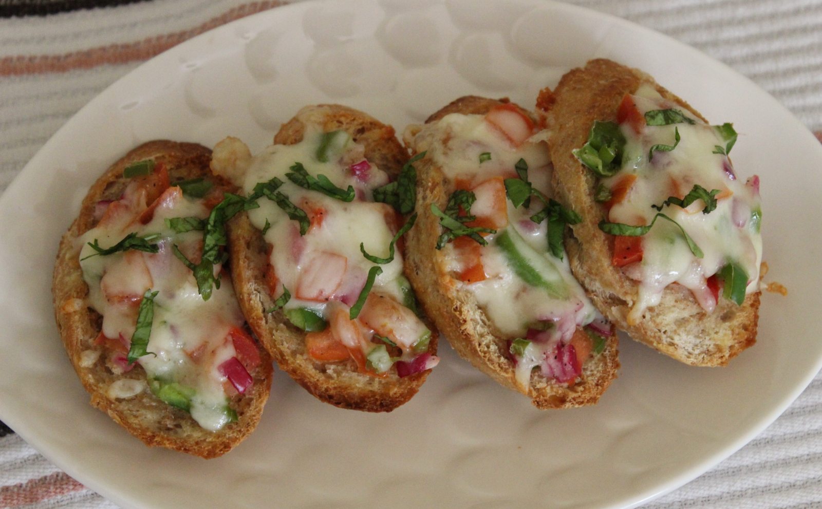 Cheesy Bruschetta with capsicum and tomatoes