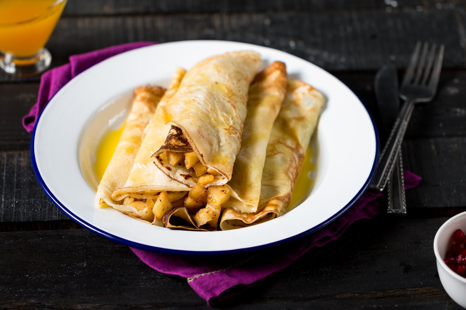 Crepes Filled With Apples & Topped With Orange Sauce