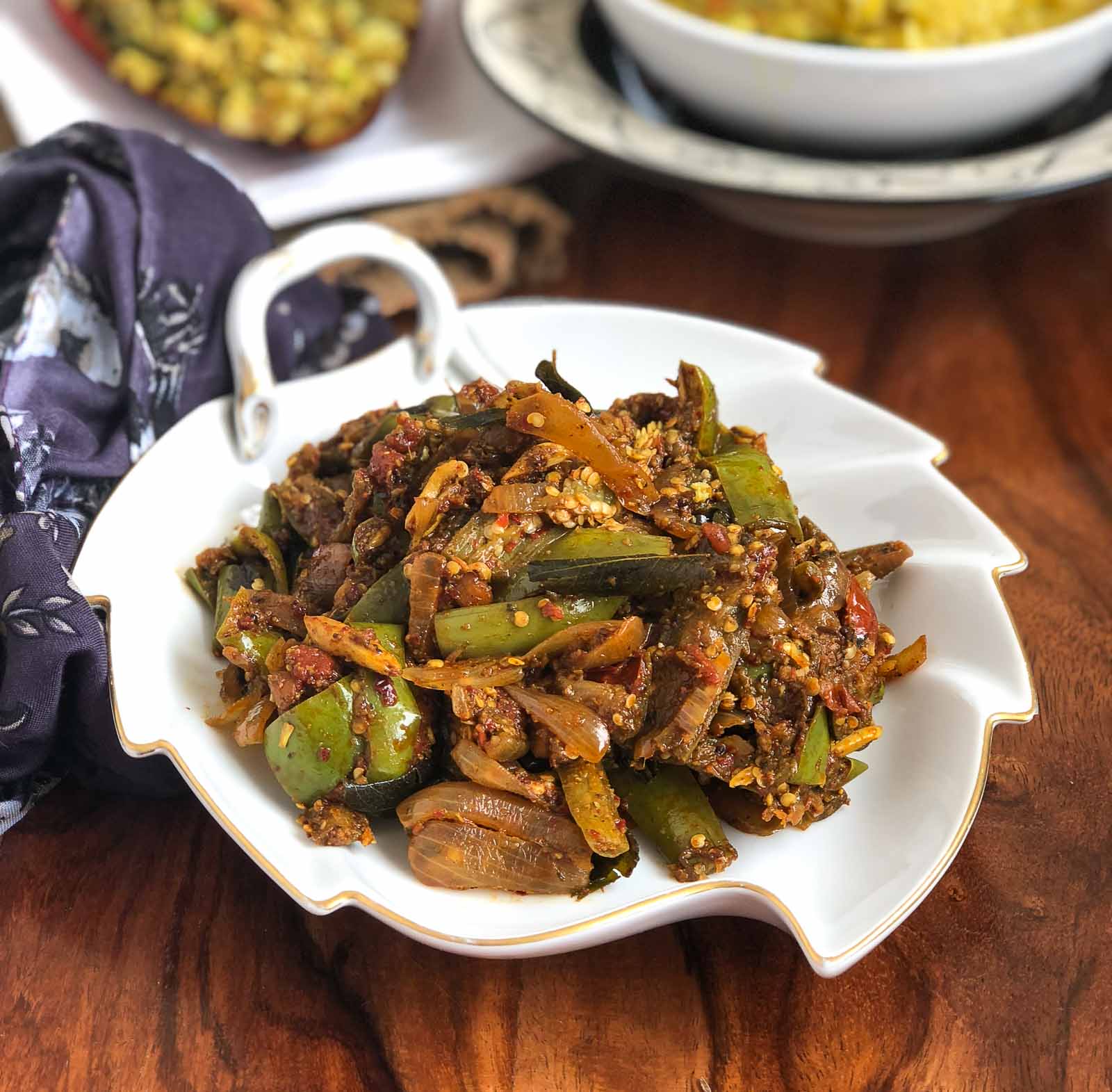 Kathirikai Poondu Pirattal Recipe - South Indian Style Brinjal Stir Fry With Garlic