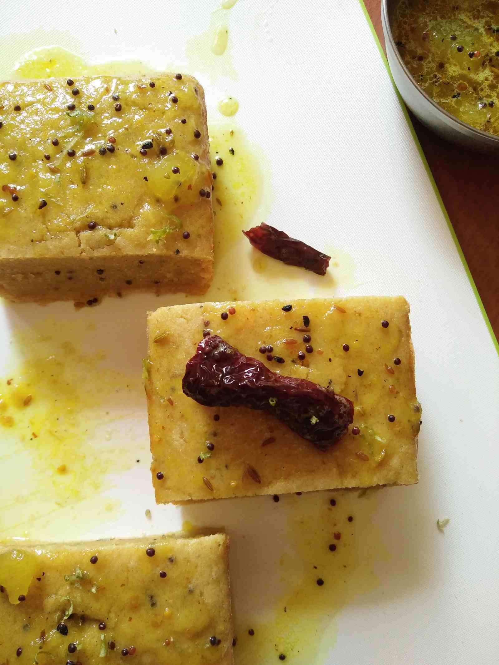 Raw Mango Dhokla Recipe Topped With Sweet Mango Chutney