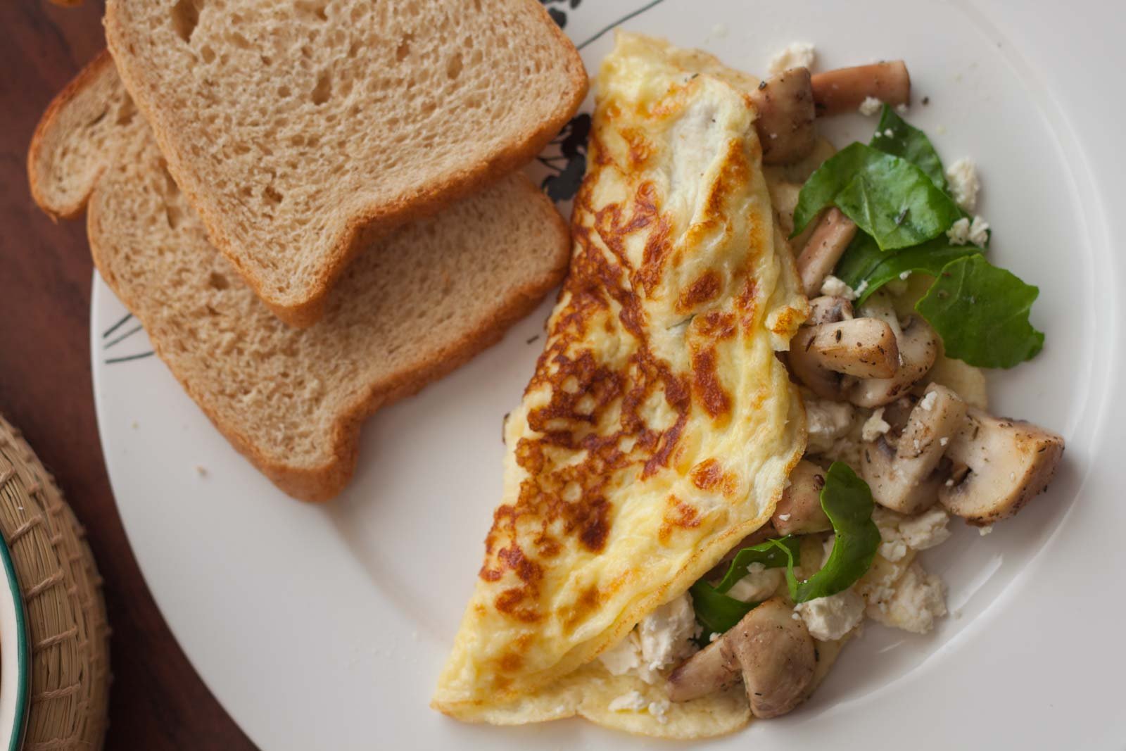 Omelette stuffed with mushroom, spinach and goats cheese