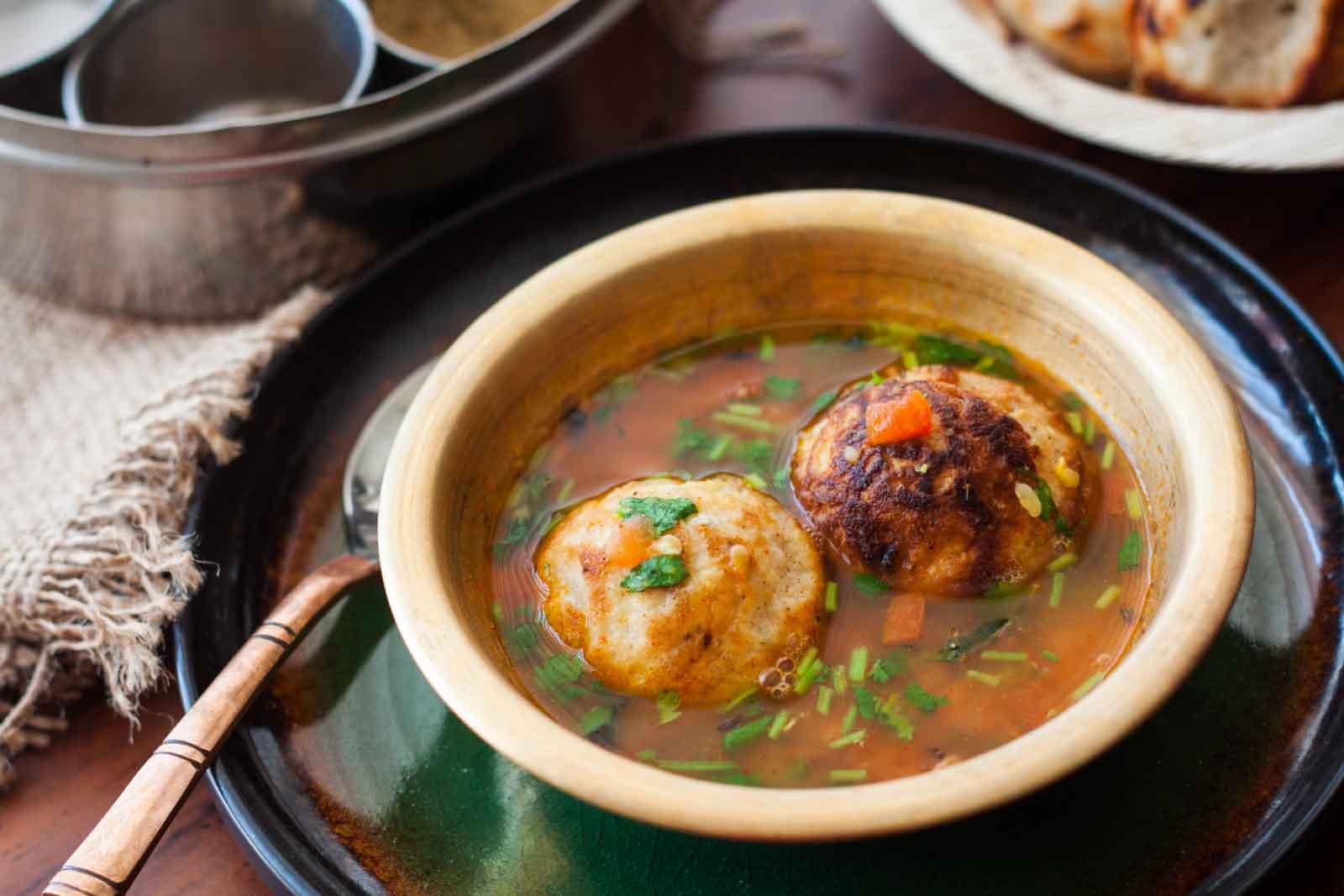 Karnataka Style Bonda Soup Recipe-Urad dal Fritters in Spicy Dal Soup 