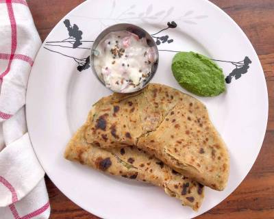 Breakfast Meal Plate: Aloo Paratha, Tomato Onion Tadka Raita And Lehsuni Pudina Chutney