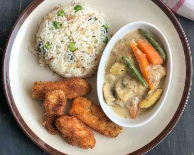 Here Is A Delicious Continental Dinner - Mushroom Stroganoff, Herbed Rice & Fish Fingers