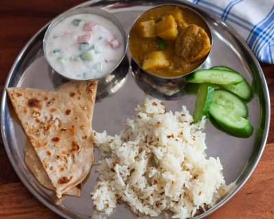 Everyday Meal Plates: Dhania Murgh Makhani, Garlic Naan, Jeera Pulao, Raita & Salad