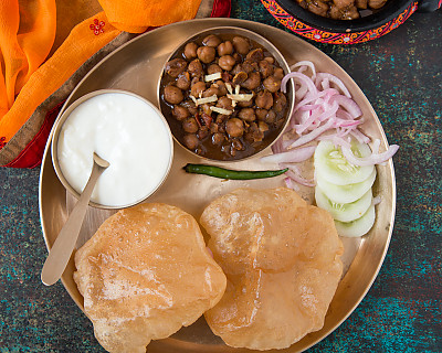 Soulful Meal Plate: Amritsari Chole, Lacha Pyaz, Puri, Cucumber, Curd