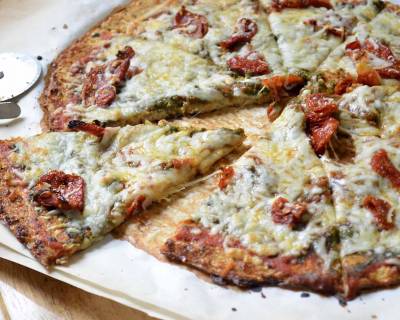 Cauliflower Crust Pizza With Pesto, Sundried Tomatoes & Goat Cheese