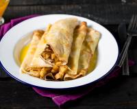 Crepes Filled With Apples & Topped With Orange Sauce