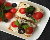 Italian Ricotta Crostini with Olives and Cherry Tomatoes Recipe