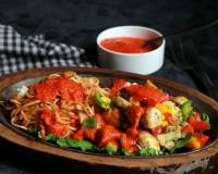 Noodle Sizzler With Garlic Pepper Sauce And Baked Vegetables Recipe