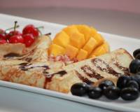 Pancakes Drizzled With Chocolate Sauce Served With Fruits & Jaggery Recipe (Breakfast In Bed)