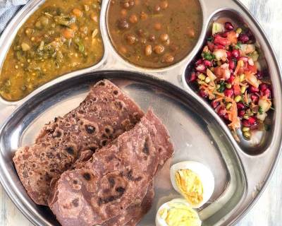 Portion Control Meal Plate Ragi Tawa Paratha Amritsari Kala Chana Sai Bhaji Kosambari Boiled Egg