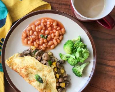 Breakfast Meal Plate : Mushroom & Sweet Corn Stuffed Omelette, Baked Beans And Coffee