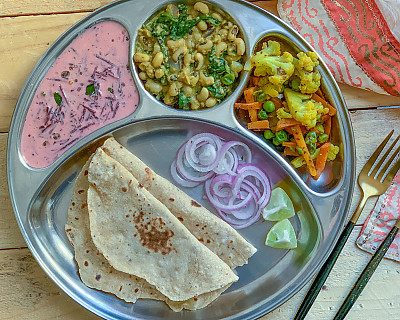 Portion Control Meal Plate: Lobia Palak Curry, Carrot Cauliflower Sabzi, Beetroot Raita, and Jowar Roti 